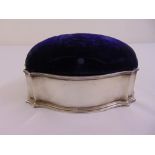 A silver sewing box shaped oval with hinged padded top, London 1915 A/F