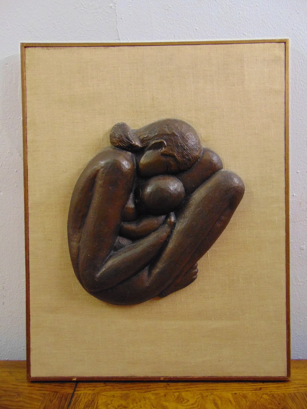 A framed bronze relief of a mother and child signed Ofer, 46.5 x 36.5cm