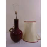 Chinese ox blood red baluster vase converted to a table lamp, to include silk shade