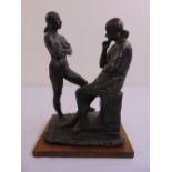 A cast bronze figural group of two women signed Snowden on a wood base