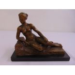 A bronze figurine of a recumbent naked lady signed Citrine on a rectangular black stone base