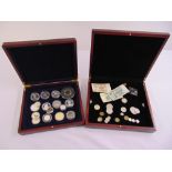 A quantity of coins and bank notes in two fitted wooden cases