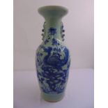 An oriental baluster form vase decorated with flowers, leaves and exotic birds