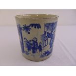 A Chinese blue and white brush pot of tapering cylindrical form decorated with figures to the sides