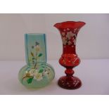 Two continental hand painted coloured glass vases