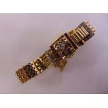 9ct yellow gold ladies cocktail watch set with diamonds and rubies, approx total weight 33.7g