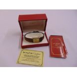 A Must de Cartier gold plated tank watch on leather bracelet in original packaging and