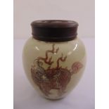 A Chinese ginger jar decorated with a dragon and with a pierced hardwood pull off cover