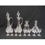 A quantity of glass to include wine jugs, decanters and eight sherry glasses