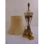 A gilt metal and porcelain table lamp on triform base with silk shade