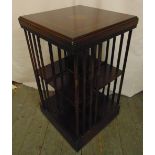 An Edwardian rectangular revolving bookcase with inlaid top and slatted sides