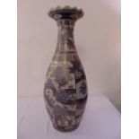 A 20th century oriental style floor vase decorated with flowers, leaves and geometric forms 92cm (