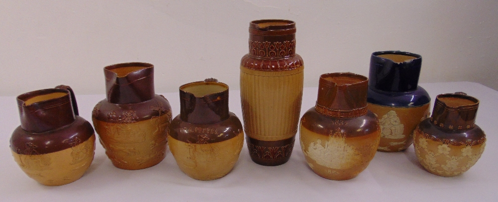 Seven Doulton Lambeth ceramic jugs, marks to the bases