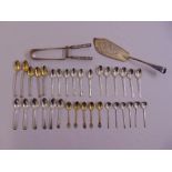 A Victorian silver fish slice London 1853, a Victorian silver asparagus server London 1894 and a