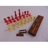 A composition chess set, a set of miniature dominoes and a cribbage board with counters