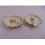 A pair of Royal Copenhagen dishes of shaped oval form decorated with flowers and leaves, marks to