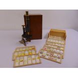A mahogany cased microscope and a cased set of prepared microscope slides approx 60