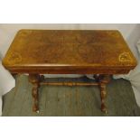 A Victorian rectangular walnut card table on four scroll legs A/F