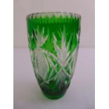 A continental green overlaid glass vase decorated with stylised leaves