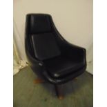 Black leather occasional chair on revolving pedestal base, circa 1970