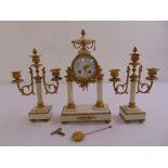 A French white marble and gilded metal mantle clock with white enamel dial and Arabic numerals