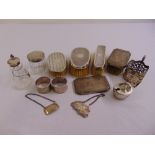 A quantity of silver to include napkin rings, hair brushes, wine labels, mustard pot, dressing table