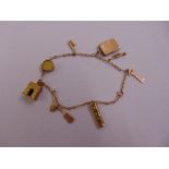 9ct yellow gold charm bracelet with nine charms, approx total weight 7.2g