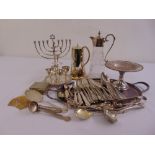 A quantity of silver plate to include a claret jug, a Menorah, a tray, a coffee pot and flatware
