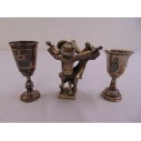 Two silver Kiddush cups and an Israeli silver figurine of three Rabbis dancing