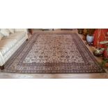 A cream ground Persian carpet with repeating floral pattern and border, 3.7m x 2.8m