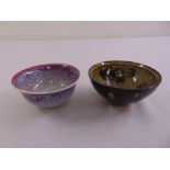 Two Chinese tea bowls on rimmed feet