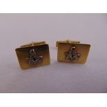 A pair of 14ct gold and diamond cufflinks with applied Masonic symbols, approx total weight 10.6g