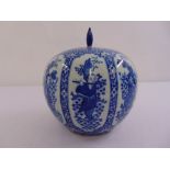 A Chinese blue and white ginger jar and cover decorated with figures and flowers, six character