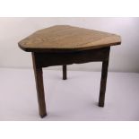 A 19th century country oak and elm cricket table, with three chamfered legs, possibly Welsh