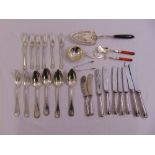 A quantity of silver and white metal flatware to include a fish slice and a caddy spoon