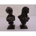 A pair of late 19th century cast bronze busts of an Arab gentleman and a woman on square plinths