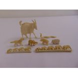 A quantity of composition and bone figurines of animals (8)