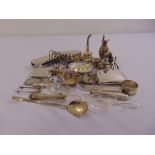 A quantity of hallmarked silver to include a wine funnel, a toast rack, and flatware (25)