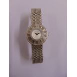A Tiffany and Co. 18ct white gold ladies wristwatch with diamond bezel and original receipt,