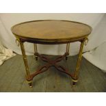 A continental gilded metal and mahogany circular occasional table on simulated bamboo brass legs