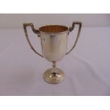 A silver two handled trophy cup on circular spreading base, Sheffield 1916