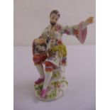 Meissen chinoiserie figurine of a man and dog, impressed E35, marks to the base