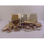 A quantity of silver plate to include entrée dishes and covers, teasets, photograph frames and a