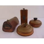 Four early 20th century brass and copper hot water bottles of varying shape and form