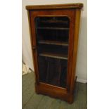 A Victorian mahogany rectangular music cabinet with hinged glazed door