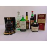 A quantity of alcohol to include Bells 1992 Christmas Bell, Courvoisier cognac, Bacardi rum and