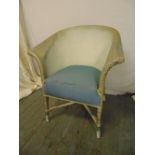 Lloyd Loom chair with upholstered seat on four turned legs