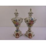 A pair of mid 20th century Italian ceramic vases with domed pull off covers decorated throughout