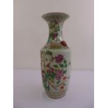 A 19th century Cantonese ovoid vase decorated with flowers, birds and leaves,