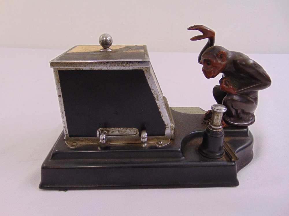 A Ronson monkey Picacig combined table lighter and cigarette box, chrome plated, enamelled brass and